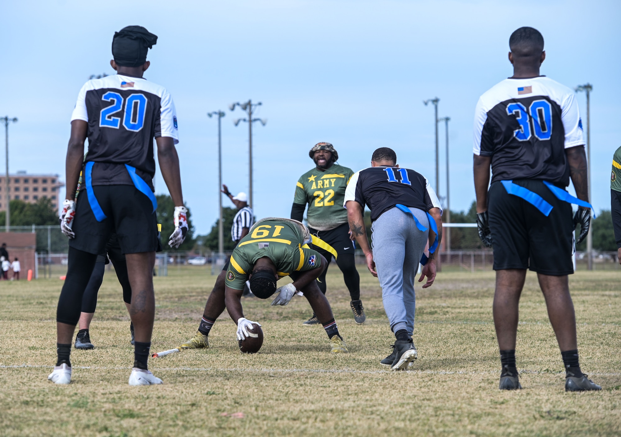 Football player hikes a football