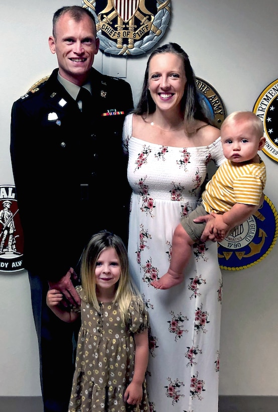 Army Capt. Kyle Smith, a logistics officer, 4th Infantry Division, Fort Carson, Colorado, poses for a photo with his wife, Mariah, daughter, Kylah, and son, Ryker, after graduating from the Captain Career Course at Fort Greg-Adam, Virginia, Aug. 24, 2023. He and his wife would take turns pushing their children in a baby jogger while he would run some of his shorter three- to seven-mile runs during marathon training. (Courtesy photo)