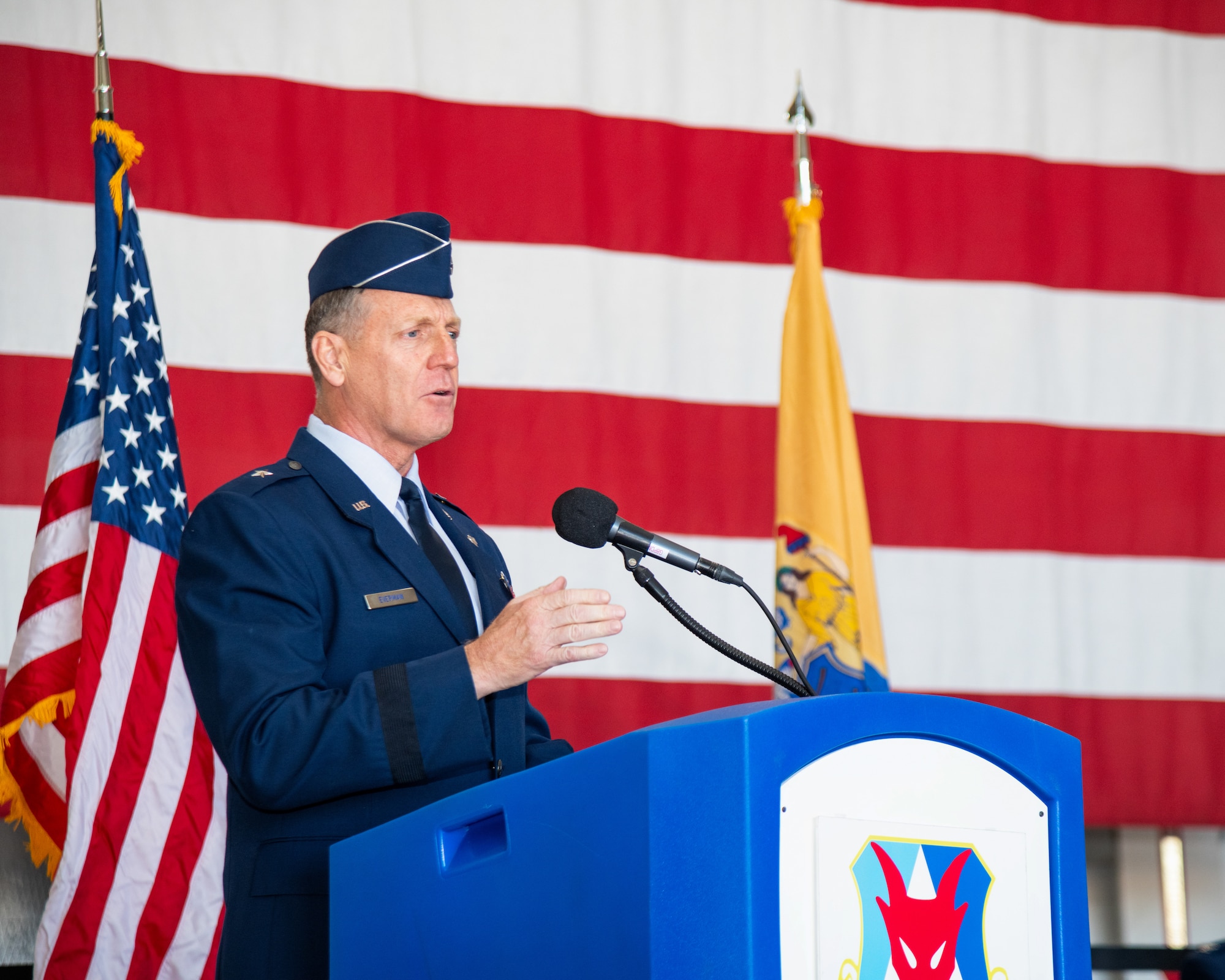 A man speaks at a podium.