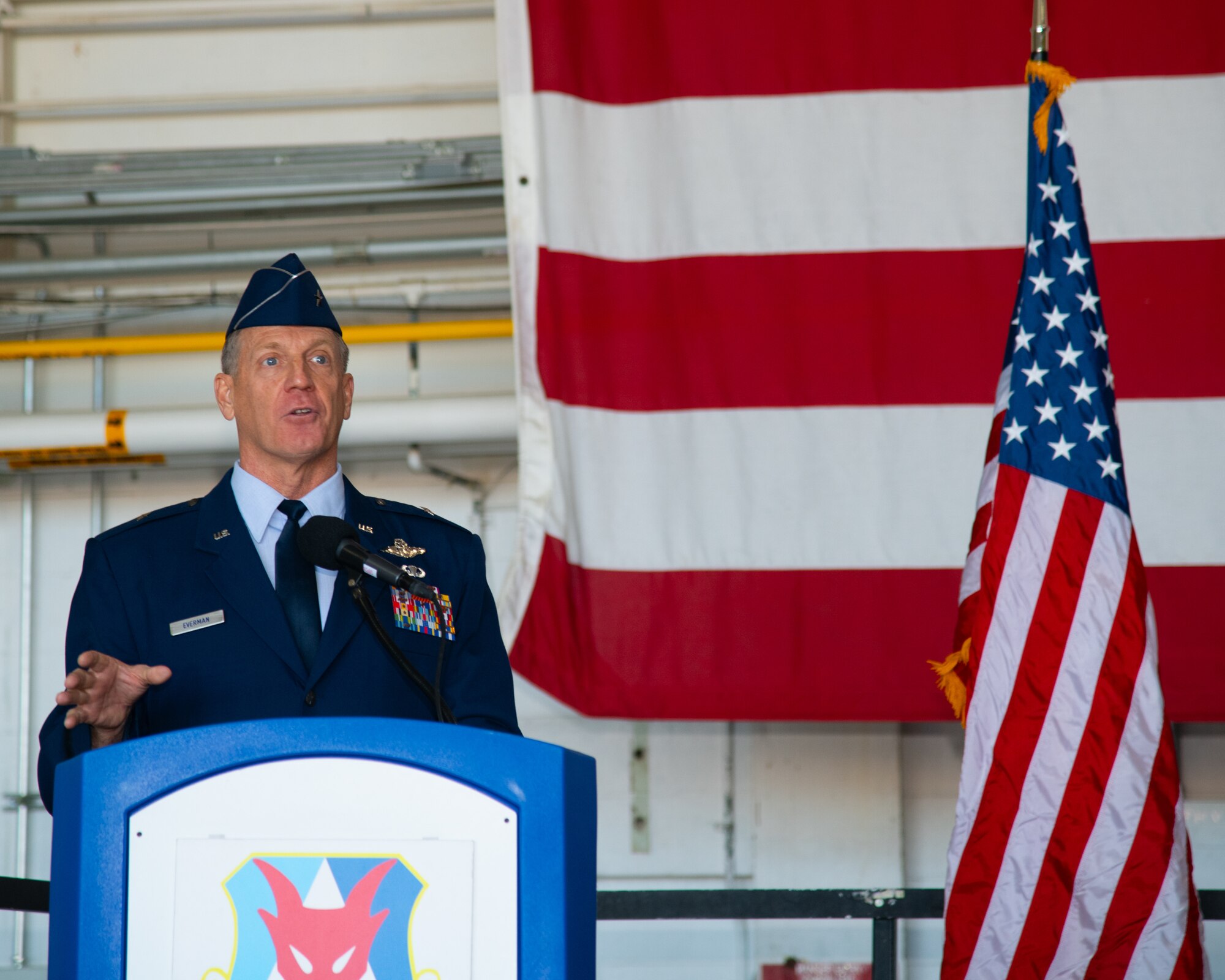 A man speaks at a podium.