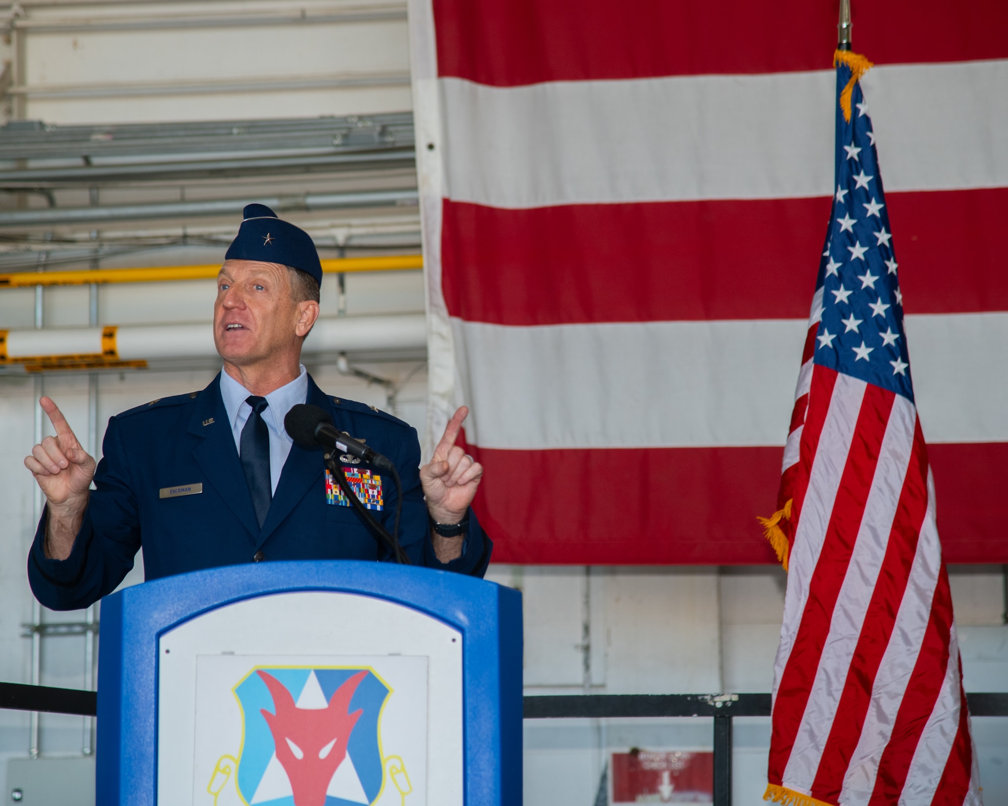A man speaks at a podium.