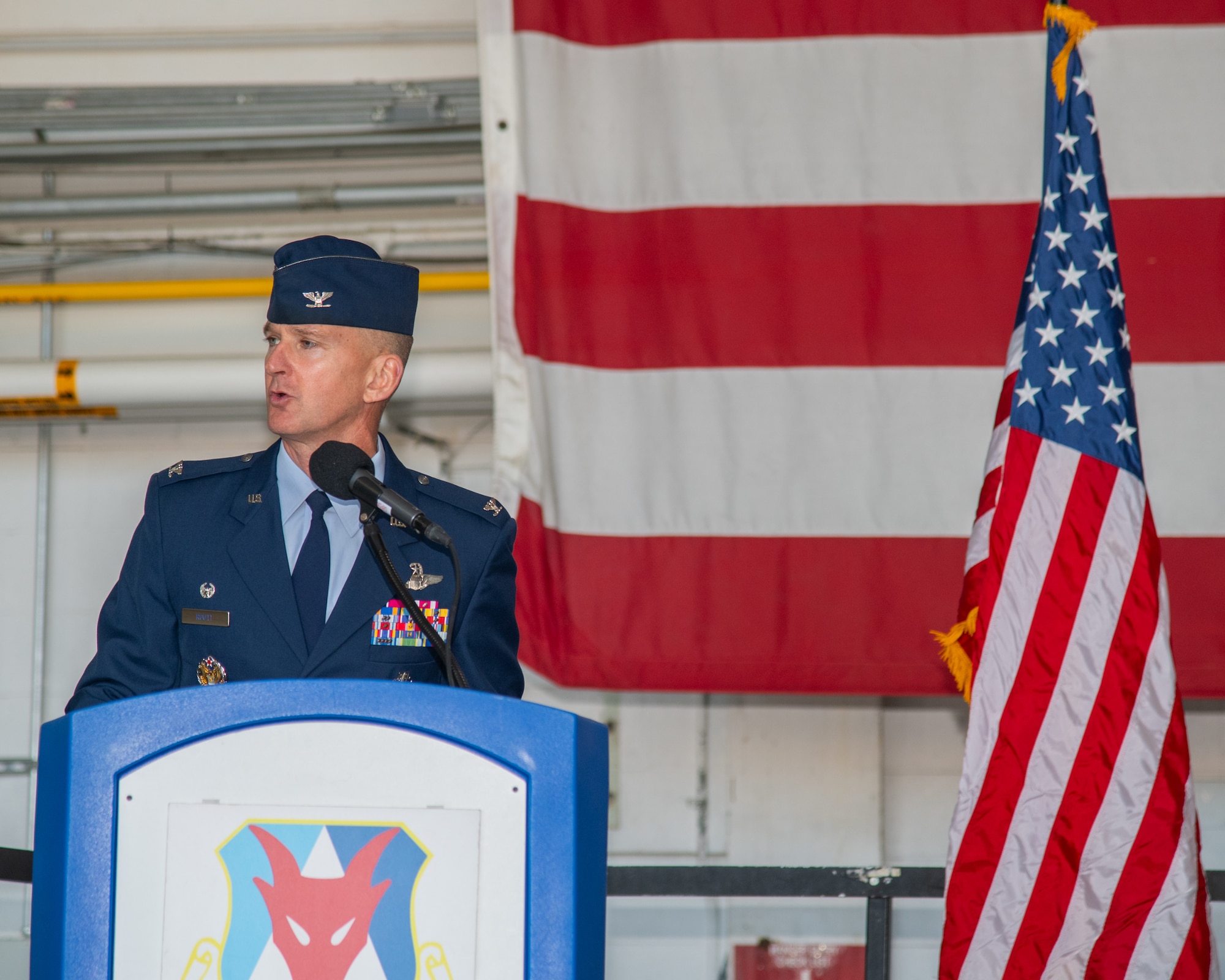 A man speaks at a podium