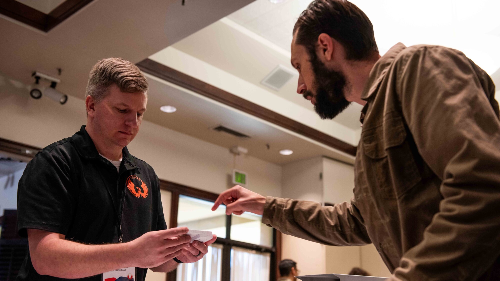 Airmen speaks with industry representatives