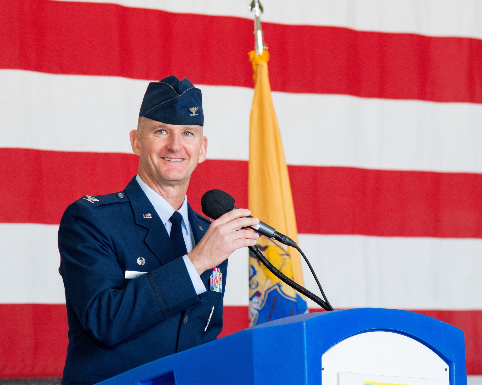 A man speaks at a podium.
