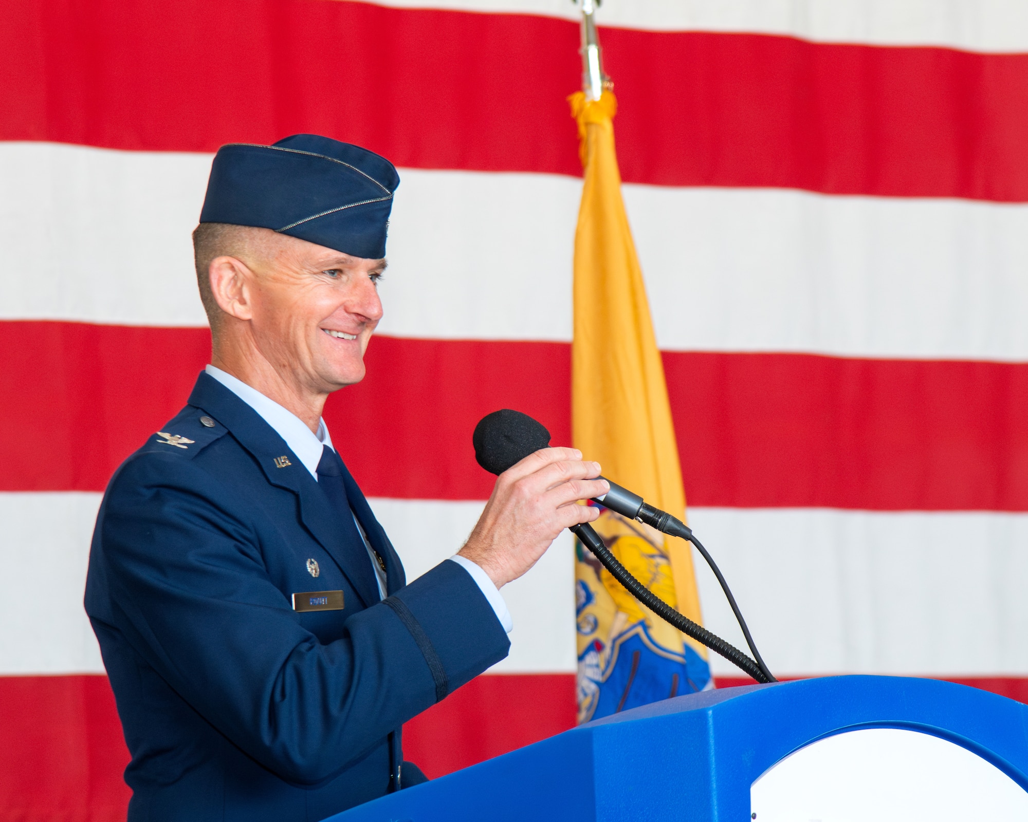 A man speaks at a podium.