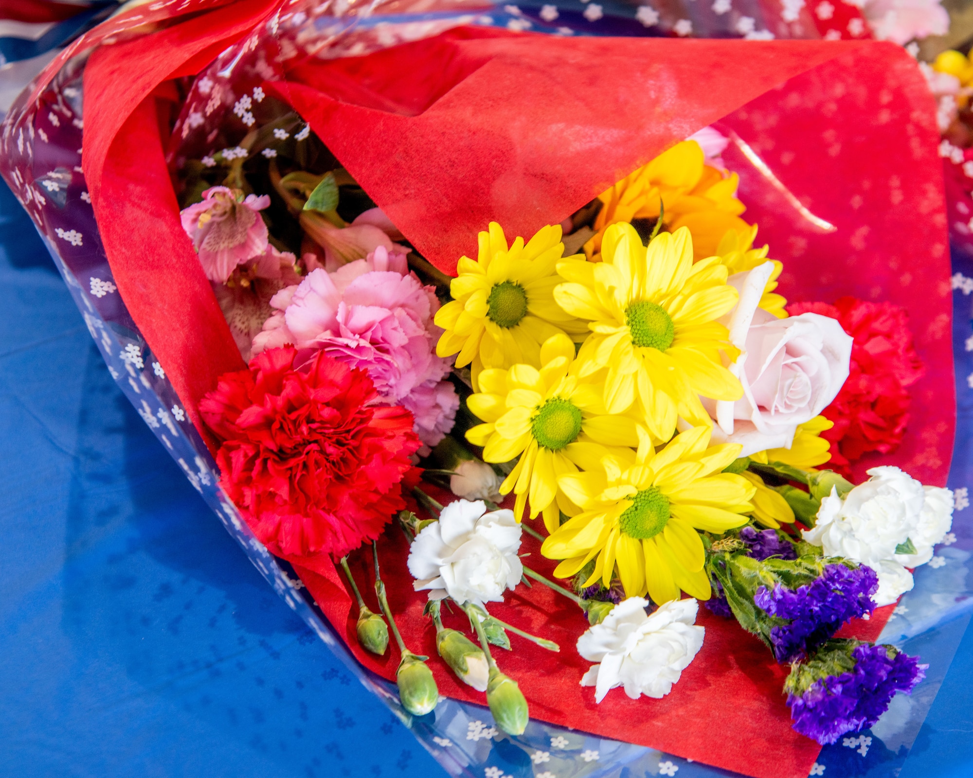 Flowers sit on a table.