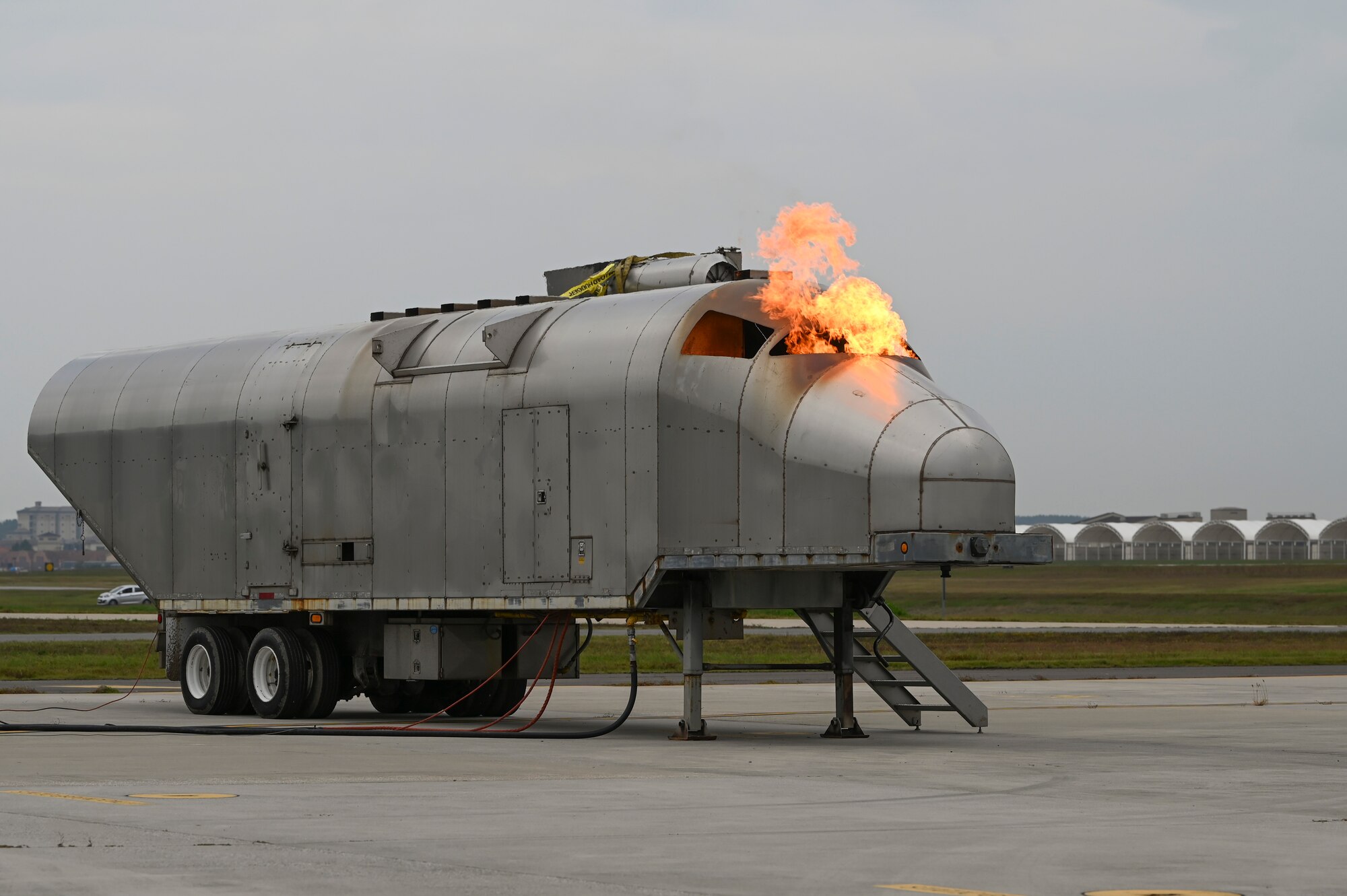 The cockpit of a simulated aircraft on fire during a mass accident response exercise.