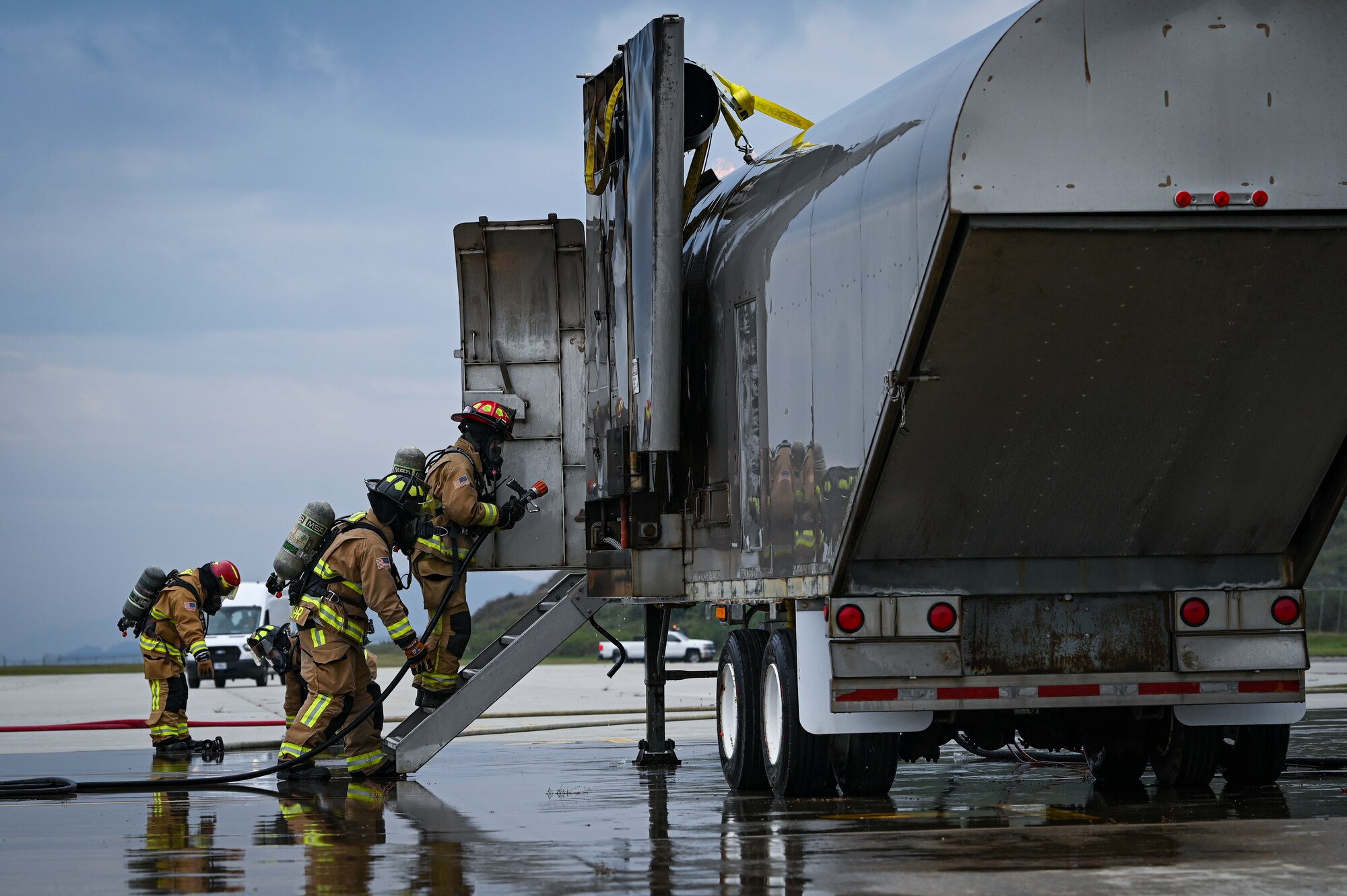U.S. Air Force firefighters, assigned to the 8th Civil Engineer Squadron, conduct simulated aircraft fire training during a mass accident response exercise.