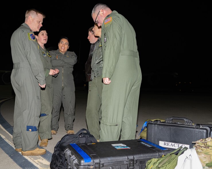 Airmen from the 625th Strategic Operations Squadron out of Offutt Air Force Base, Nebraska, prepare to board a U.S. Navy E-6B Mercury aircraft prior to the test launch of an unarmed Minuteman III intercontinental ballistic missile Nov. 5, 2024, from Vandenberg Space Force Base, California. This test, launched by the STOS team from the air, demonstrated the reliability and accuracy of the Airborne Launch Control System. (U.S. Air Force photo by Airman 1st Class Alyssa Bankston)