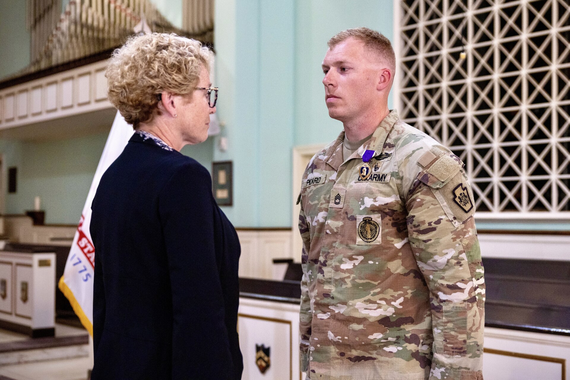 U.S. Rep. Chrissy Houlahan, left, presents a Purple Heart to U.S. Army Sgt. 1st Class Michael Picard, assigned to the Recruiting and Retention Battalion, Pennsylvania Army National Guard, during a ceremony at Valley Forge Military Academy in Wayne, Pennsylvania, Nov. 1, 2024. Picard was recognized for actions he took while deployed to Afghanistan with the Oklahoma National Guard in 2011. (U.S. Army National Guard photo Staff Sgt. Brandon Willis)