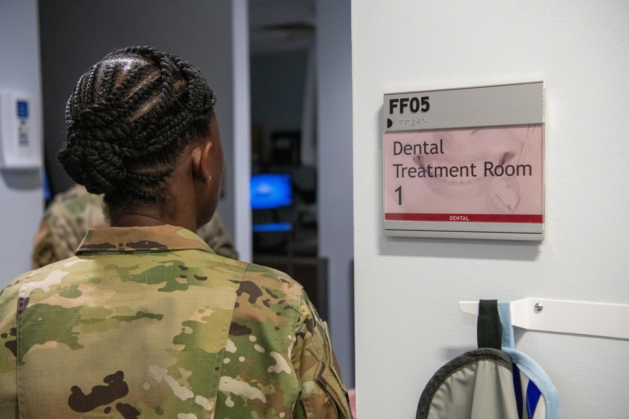 A sign reads “Dental Treatment Room 1”