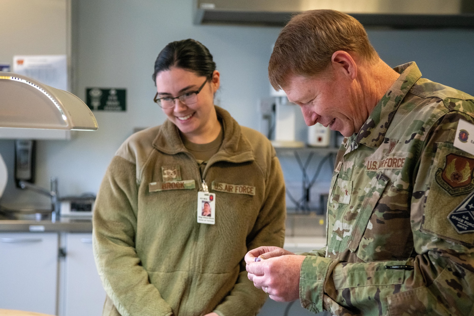 Airman inspects a dental crown