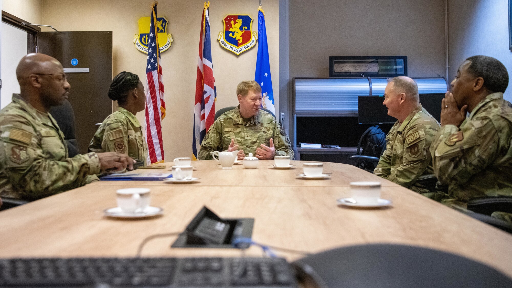 Leaders speak in a conference room