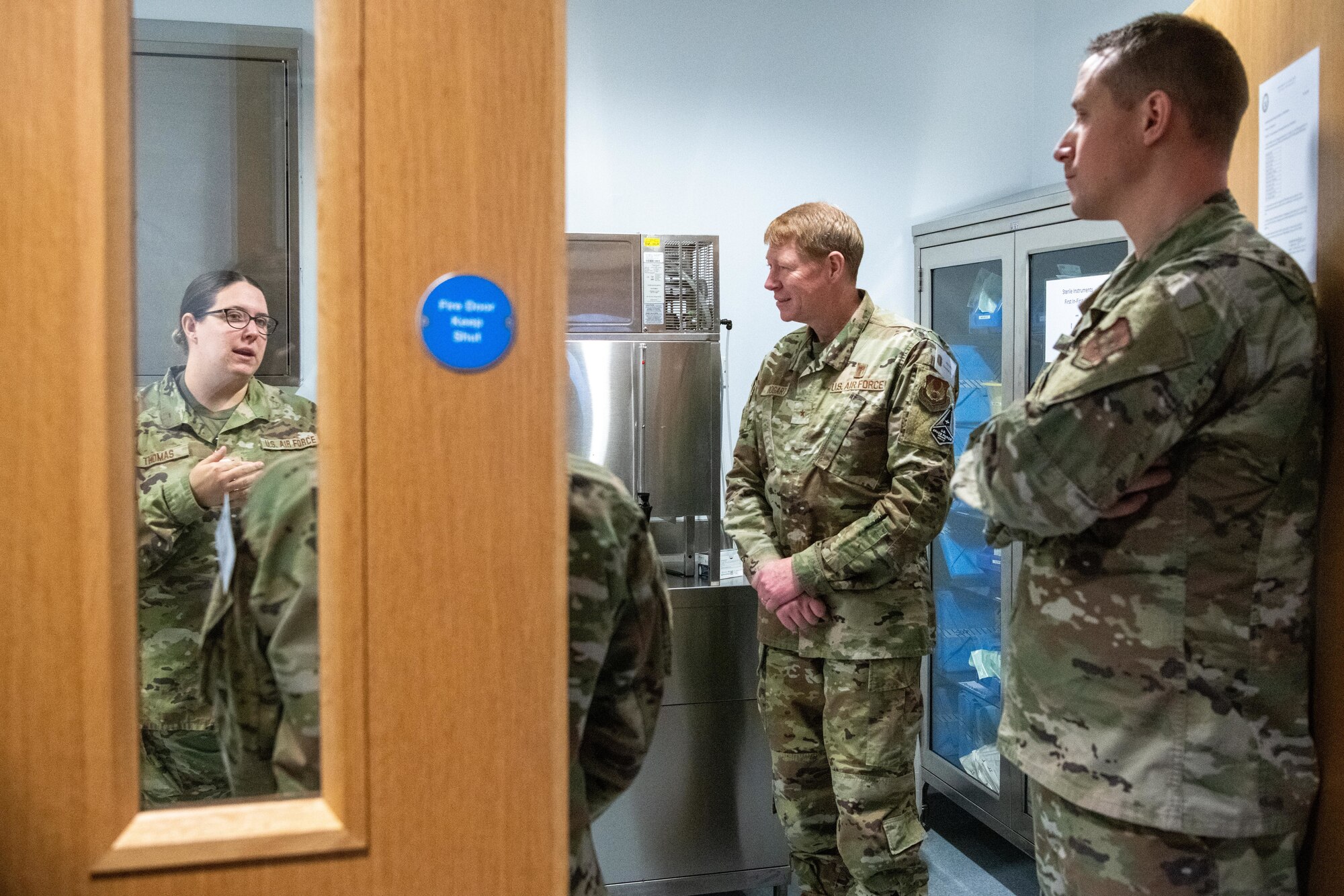 Airmen listen to a briefing