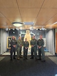 From left, U.S. Navy Cmdr. Justin Hane, Chief Intelligence Specialist Troy Bedard, Lt. Cmdr. Laura Gleis, Cmdr. Victor Cotto and Capt. Chris Turl, assigned to the U.S. 3rd Fleet Naval and Amphibious Liaison Element (NALE), pose for a photo at Joint Base Elmendorf-Richardson, Alaska, Sept. 15, 2024. The U.S. 3rd Fleet NALE and a P-8 Poseidon aircrew assigned to Patrol Squadron (VP) 9 supported joint and bi-national forces from Alaskan North American Aerospace Defense Command Region and Alaskan Command during Operation POLAR VORTEX by providing maritime domain awareness in conjunction with the 611th Air Operations Center air component to provide domain awareness during operations and exercises in remote regions of Alaska and the Arctic. (U.S. Air Force photo by Staff Sgt. Hunter Cline)