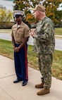 U.S. Navy Adm. Christopher Grady, Vice Chairman of the Joint Chiefs of Staff, right, recognizes Marine Corps Cpl. Keyon Halley, an administrative clerk with 9th Marine Corps District, during a visit to 9th Marine Corps District Headquarters, at Naval Station Great Lakes, Ill., Oct. 30, 2024. Adm. Grady made the visit to discuss and receive a briefing about the recruiting mission in the Midwestern United States, as well as to recognize outstanding Marines within the district headquarters. (U.S. Marine Corps photo by Cpl. Maxwell Cook)