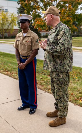 U.S. Navy Adm. Christopher Grady, Vice Chairman of the Joint Chiefs of Staff, right, recognizes Marine Corps Cpl. Keyon Halley, an administrative clerk with 9th Marine Corps District, during a visit to 9th Marine Corps District Headquarters, at Naval Station Great Lakes, Ill., Oct. 30, 2024. Adm. Grady made the visit to discuss and receive a briefing about the recruiting mission in the Midwestern United States, as well as to recognize outstanding Marines within the district headquarters. (U.S. Marine Corps photo by Cpl. Maxwell Cook)