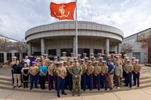 U.S. Navy Adm. Christopher Grady, stands for a group photo with Marines from 9th Marine Corps District during a visit to 9th Marine Corps District Headquarters, at Naval Station Great Lakes, Ill., Oct. 30, 2024. Adm. Grady made the visit to discuss and receive a briefing about the recruiting mission in the Midwestern United States, as well as to recognize outstanding Marines within the district headquarters. (U.S. Marine Corps photo by Cpl. Maxwell Cook)