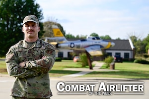 Man stands in front of a plane.