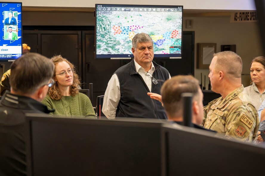 A man briefs a group of people