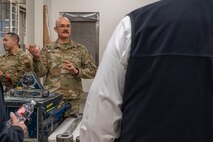 Airman speaks to a group of people