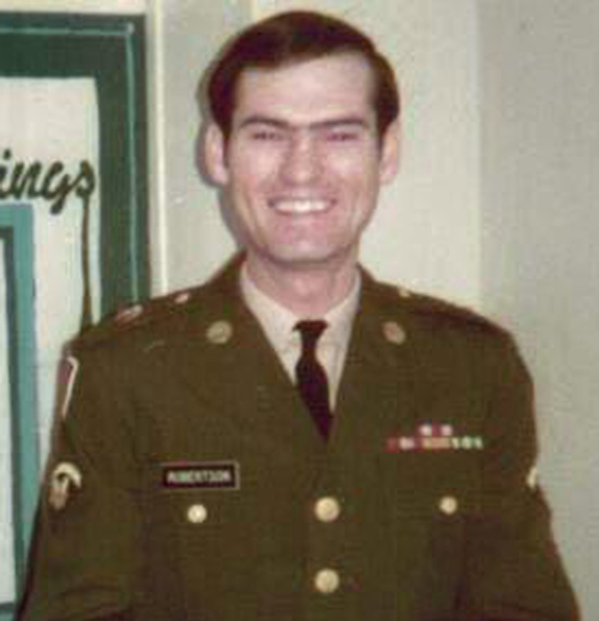 A soldier smiles for the camera.
