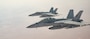 Two U.S. Navy F/A-18E Hornets fly alongside a U.S. Air Force KC-135 Stratotanker over the U.S. Central Command area of responsibility, Oct. 15, 2024. The F/A-18E is deployed to the U.S. 5th Fleet area of operations to help ensure maritime security and stability In the Middle East region. (U.S. Air Force photo) (This photo has been altered for security purposes by blurring out names on aircraft)