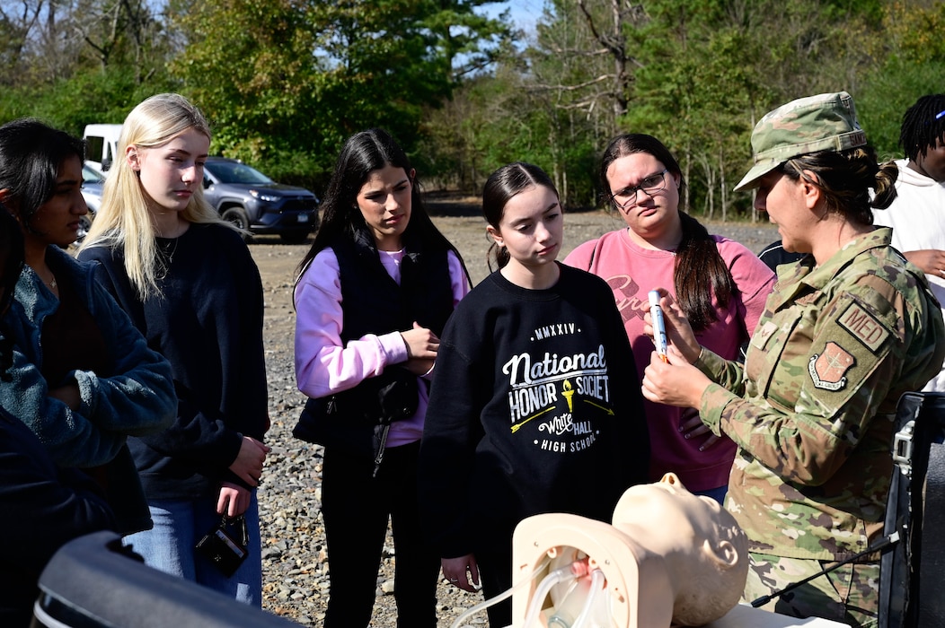 Local students learn from a medical technician