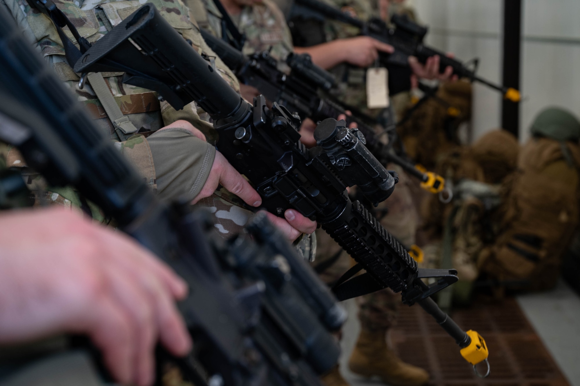 U.S. Air Force Airmen assigned to the 87th Civil Engineer Squadron perform a weapons inspection during Operation Honey Badger at Joint Base McGuire-Dix-Lakehurst, N.J., Oct. 20, 2024. OHB, is a field training exercise testing the participants skills for future conflicts in any environment. (U.S. Air Force photo by Senior Airman Aidan Thompson)