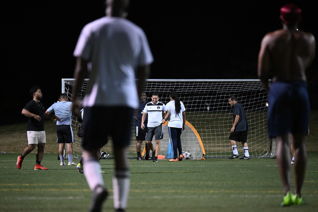 Service members and civilians unite for a pickup soccer game at Joint Base Andrews, Md., Oct. 31, 2024. By enhancing teamwork and resilience, these games contribute to building a more supportive and cohesive community at Andrews. (U.S. Air Force photo by Airman 1st Class Gianluca Ciccopiedi)