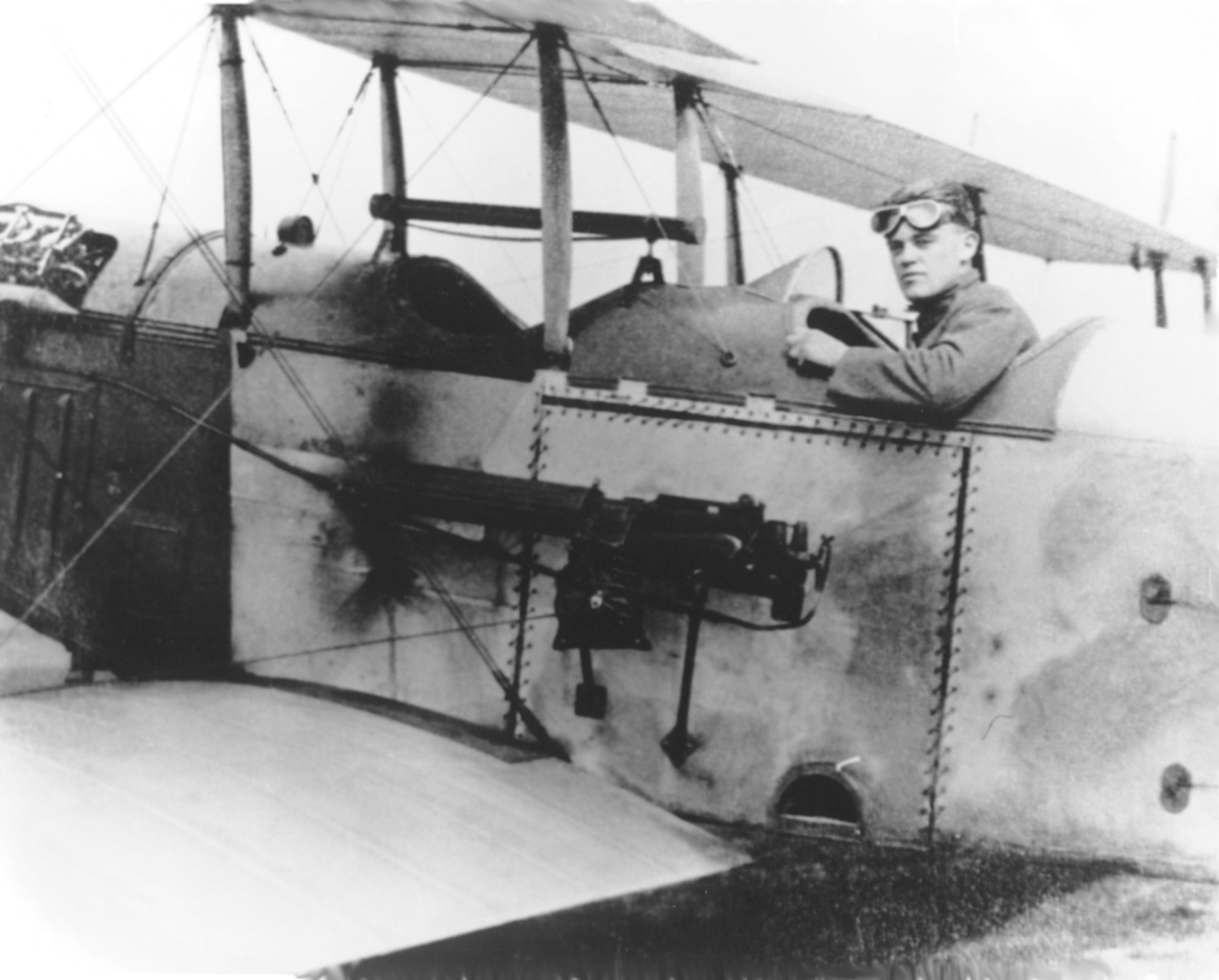 Man poses for a photo while sitting in an aircraft