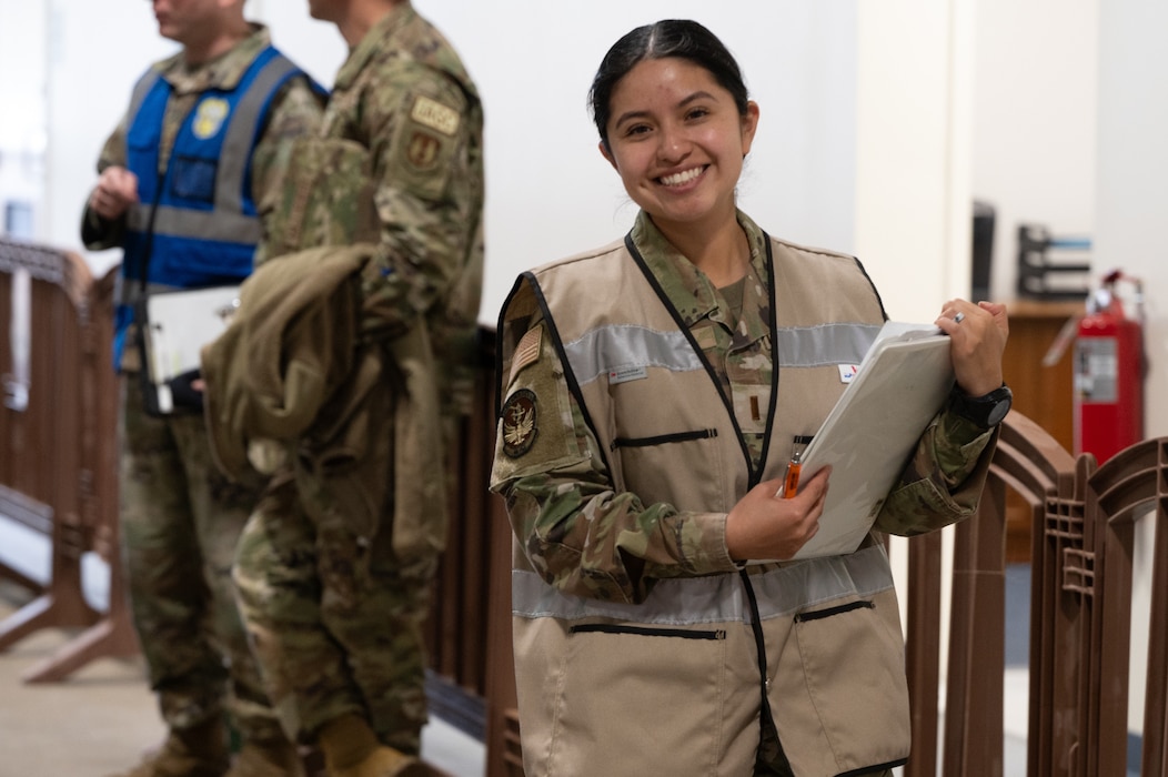 woman holds clipboard