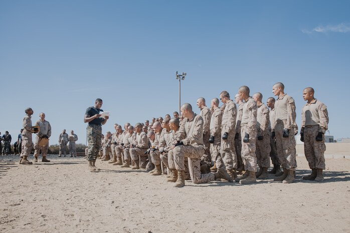 U.S. Marine Corps Martial Arts Instructor, Sgt. Thierno Jalloh, with Support Battalion, Recruit Training Regiment, conducts a roll call of recruits with Kilo Company, 3rd Recruit Training Battalion, before they conduct a Marine Corps Martial Arts Program techniques test at Marine Corps Recruit Depot San Diego, California, Oct. 24, 2024. MCMAP aims to strengthen the mental and moral resiliency of recruits and Marines through realistic combative training, warrior ethos studies, and physical hardening. (U.S. Marine Corps photo by Cpl. Sarah M. Grawcock)