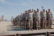 U.S. Marine Corps recruits with Kilo Company, 3rd Recruit Training Battalion, stand at attention before they conduct a Marine Corps Martial Arts Program techniques test at Marine Corps Recruit Depot San Diego, California, Oct. 24, 2024. MCMAP aims to strengthen the mental and moral resiliency of recruits and Marines through realistic combative training, warrior ethos studies, and physical hardening. (U.S. Marine Corps photo by Cpl. Sarah M. Grawcock)