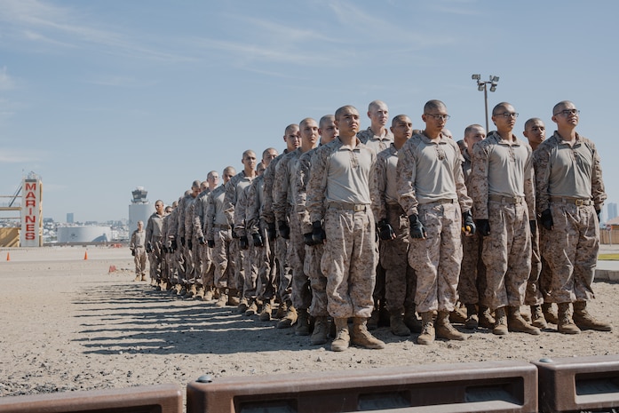 U.S. Marine Corps recruits with Kilo Company, 3rd Recruit Training Battalion, stand at attention before they conduct a Marine Corps Martial Arts Program techniques test at Marine Corps Recruit Depot San Diego, California, Oct. 24, 2024. MCMAP aims to strengthen the mental and moral resiliency of recruits and Marines through realistic combative training, warrior ethos studies, and physical hardening. (U.S. Marine Corps photo by Cpl. Sarah M. Grawcock)
