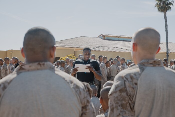 U.S. Marine Corps Martial Arts Instructor, Sgt. Thierno Jalloh, with Support Battalion, Recruit Training Regiment, gets a roll call of recruits with Kilo Company, 3rd Recruit Training Battalion, before they conduct a Marine Corps Martial Arts Program techniques test at Marine Corps Recruit Depot San Diego, California, Oct. 24, 2024. MCMAP aims to strengthen the mental and moral resiliency of recruits and Marines through realistic combative training, warrior ethos studies, and physical hardening. (U.S. Marine Corps photo by Cpl. Sarah M. Grawcock)