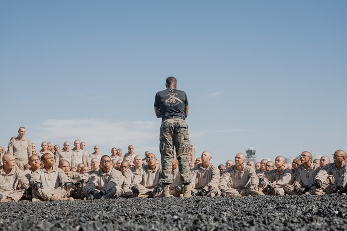 U.S. Marine Corps Martial Arts Instructor, Sgt. Thierno Jalloh, with Support Battalion, Recruit Training Regiment, gives a brief to recruits with Kilo Company, 3rd Recruit Training Battalion, before they conduct a Marine Corps Martial Arts Program techniques test at Marine Corps Recruit Depot San Diego, California, Oct. 24, 2024. MCMAP aims to strengthen the mental and moral resiliency of recruits and Marines through realistic combative training, warrior ethos studies, and physical hardening. (U.S. Marine Corps photo by Cpl. Sarah M. Grawcock)