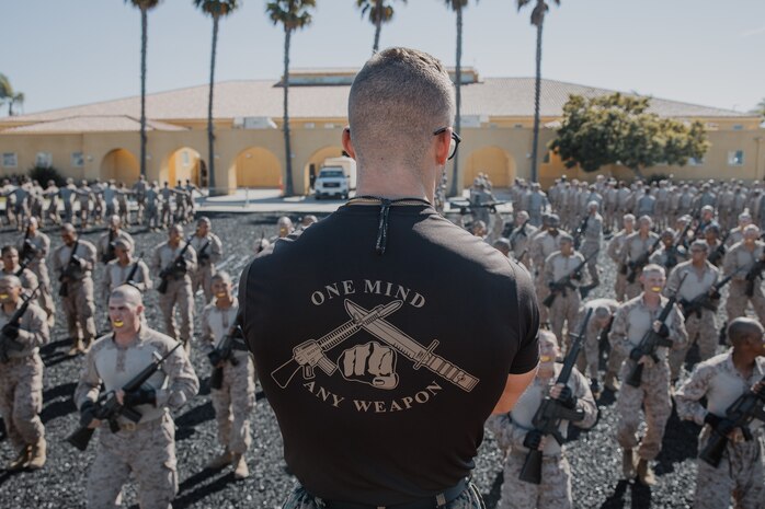 U.S. Marine Corps Martial Arts Instructor, Staff Sgt. Jacob Sinclair, with Support Battalion, Recruit Training Regiment, instructs recruits with Kilo Company, 3rd Recruit Training Battalion, during their Marine Corps Martial Arts Program techniques test at Marine Corps Recruit Depot San Diego, California, Oct. 24, 2024. MCMAP aims to strengthen the mental and moral resiliency of recruits and Marines through realistic combative training, warrior ethos studies, and physical hardening. (U.S. Marine Corps photo by Cpl. Sarah M. Grawcock)