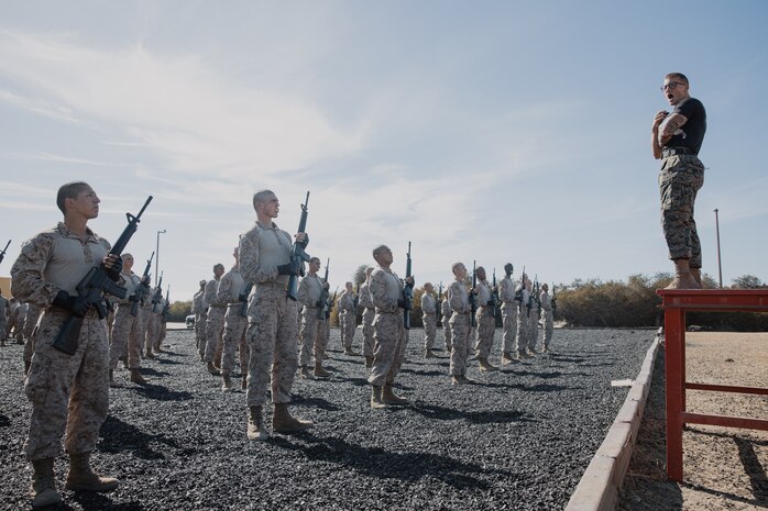 U.S. Marine Corps Martial Arts Instructor, Staff Sgt. Jacob Sinclair, with Support Battalion, Recruit Training Regiment, instructs recruits with Kilo Company, 3rd Recruit Training Battalion during their Marine Corps Martial Arts Program techniques test at Marine Corps Recruit Depot San Diego, California, Oct. 24, 2024. MCMAP aims to strengthen the mental and moral resiliency of recruits and Marines through realistic combative training, warrior ethos studies, and physical hardening. (U.S. Marine Corps photo by Cpl. Sarah M. Grawcock)