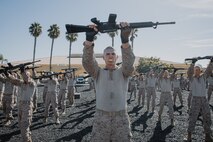 U.S. Marine Corps recruits with Kilo Company, 3rd Recruit Training Battalion, execute a high block during a Marine Corps Martial Arts Program techniques test at Marine Corps Recruit Depot San Diego, California, Oct. 24, 2024. MCMAP aims to strengthen the mental and moral resiliency of recruits and Marines through realistic combative training, warrior ethos studies, and physical hardening. (U.S. Marine Corps photo by Cpl. Sarah M. Grawcock)