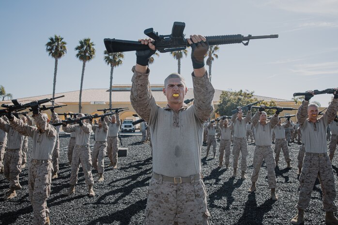 U.S. Marine Corps recruits with Kilo Company, 3rd Recruit Training Battalion, execute a high block during a Marine Corps Martial Arts Program techniques test at Marine Corps Recruit Depot San Diego, California, Oct. 24, 2024. MCMAP aims to strengthen the mental and moral resiliency of recruits and Marines through realistic combative training, warrior ethos studies, and physical hardening. (U.S. Marine Corps photo by Cpl. Sarah M. Grawcock)