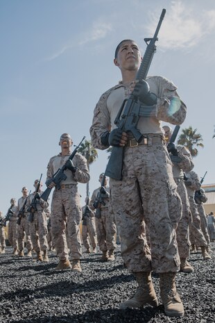 U.S. Marine Corps recruits with Kilo Company, 3rd Recruit Training Battalion, wait for further instruction during a Marine Corps Martial Arts Program techniques test at Marine Corps Recruit Depot San Diego, California, Oct. 24, 2024. MCMAP aims to strengthen the mental and moral resiliency of recruits and Marines through realistic combative training, warrior ethos studies, and physical hardening. (U.S. Marine Corps photo by Cpl. Sarah M. Grawcock)