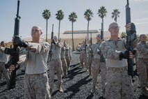U.S. Marine Corps recruits with Kilo Company, 3rd Recruit Training Battalion, execute a mid-block during a Marine Corps Martial Arts Program techniques test at Marine Corps Recruit Depot San Diego, California, Oct. 24, 2024. MCMAP aims to strengthen the mental and moral resiliency of recruits and Marines through realistic combative training, warrior ethos studies, and physical hardening. (U.S. Marine Corps photo by Cpl. Sarah M. Grawcock)