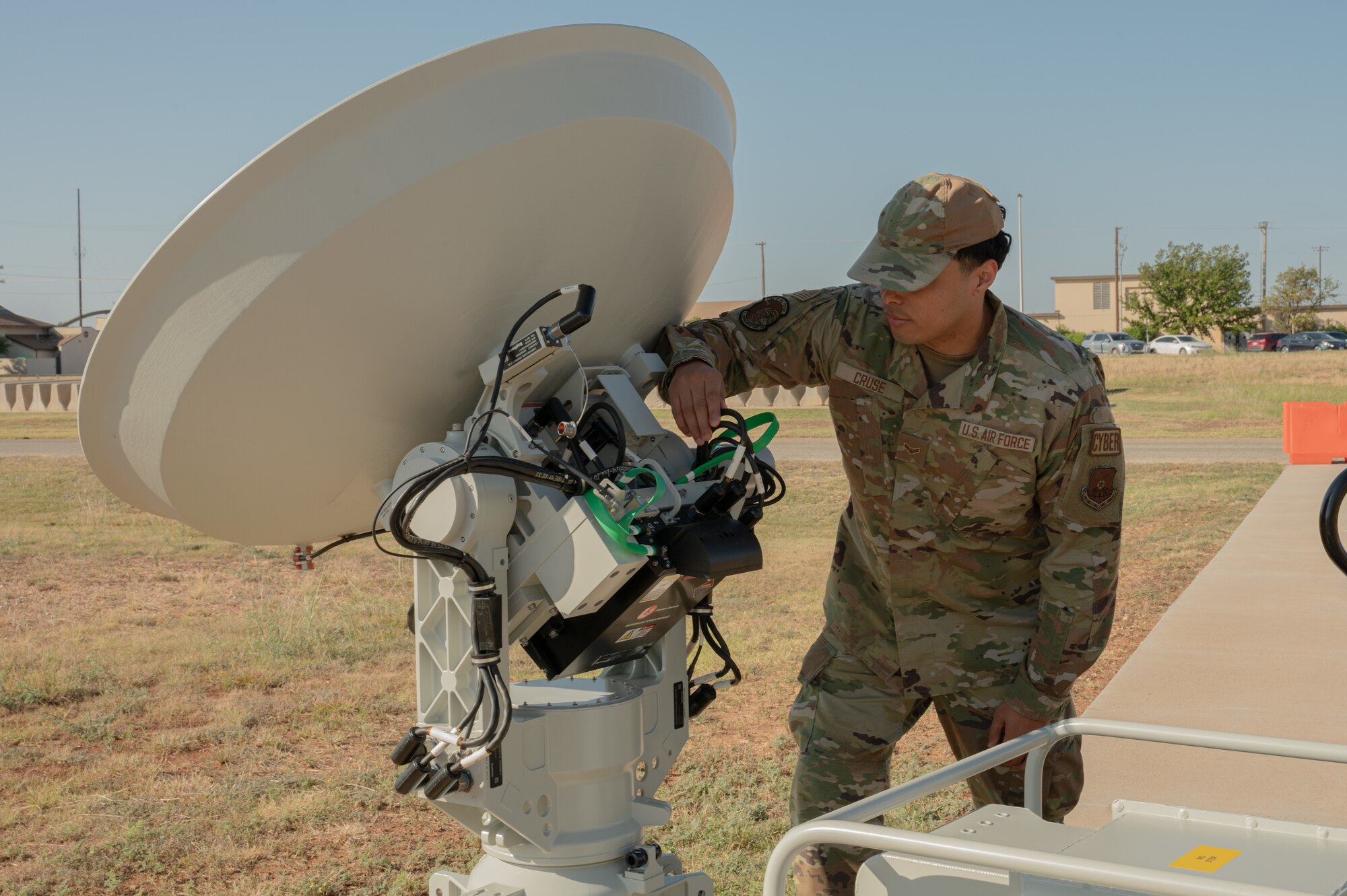 U.S. Air Force Airman 1st Class Michael Cruse, 7th Communications Squadron network infrastructure technician, reboots the Global Aircrew Strategic Network Terminal antenna control system at Dyess Air Force Base, Oct. 31, 2024. The GASNT has advanced encryption technologies and multi-frequency capabilities, enabling secure, real-time communication. (U.S. Air Force photo by Senior Airman Alondra Cristobal Hernandez)