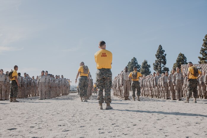U.S. Marine Corps Capt. Riley Vickner, a series commander with Fox Company, 2nd Recruit Training Battalion, observes recruits prior to the confidence course training event at Marine Corps Recruit Depot San Diego, California, Oct. 24, 2024. The confidence course challenges recruits physically and mentally through obstacles that require confidence in their strength, balance, and determination. (U.S. Marine Corps photo by Cpl. Sarah M. Grawcock)