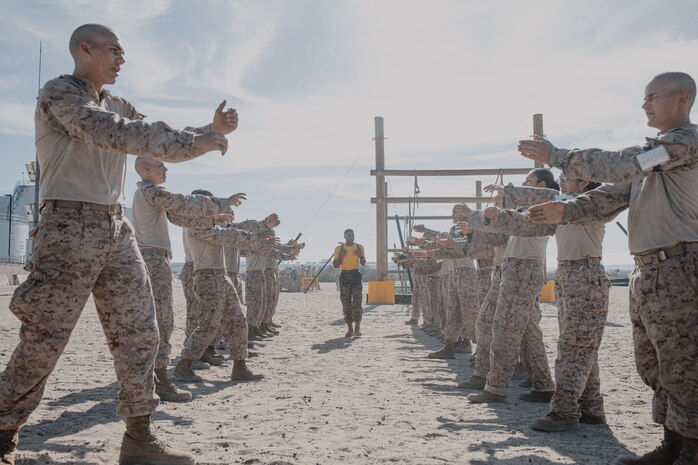 U.S. Marine Corps Sgt. Justin Miranda, a drill instructor with Fox Company, 2nd Recruit Training Battalion, instructs recruits during a confidence course training event at Marine Corps Recruit Depot San Diego, California, Oct. 24, 2024. The confidence course challenges recruits physically and mentally through obstacles that require confidence in their strength, balance, and determination. (U.S. Marine Corps photo by Cpl. Sarah M. Grawcock)