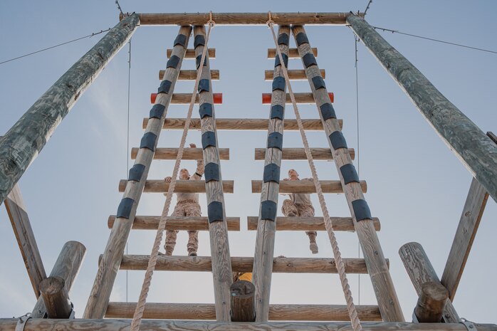 U.S. Marine Corps recruits with Fox Company, 2nd Recruit Training Battalion, climb up an obstacle during a confidence course training event at Marine Corps Recruit Depot San Diego, California, Oct. 24, 2024. The confidence course challenges recruits physically and mentally through obstacles that require confidence in their strength, balance, and determination. (U.S. Marine Corps photo by Cpl. Sarah M. Grawcock)