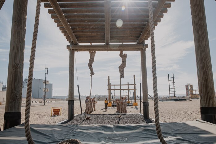 U.S. Marine Corps recruits with Fox Company, 2nd Recruit Training Battalion, navigate through an obstacle during a confidence course training event at Marine Corps Recruit Depot San Diego, California, Oct. 24, 2024. The confidence course challenges recruits physically and mentally through obstacles that require confidence in their strength, balance, and determination. (U.S. Marine Corps photo by Cpl. Sarah M. Grawcock)