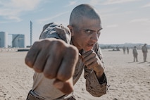 U.S. Marine Corps Recruit Howard Grisler  with Fox Company, 2nd Recruit Training Battalion, executes Marine Corps Martial Arts Program techniques during a confidence course training event at Marine Corps Recruit Depot San Diego, California, Oct. 24, 2024. The confidence course challenges recruits physically and mentally through obstacles that require confidence in their strength, balance, and determination. (U.S. Marine Corps photo by Cpl. Sarah M. Grawcock)