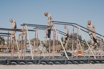 U.S. Marine Corps recruits with Fox Company, 2nd Recruit Training Battalion, navigate through an obstacle during a confidence course training event at Marine Corps Recruit Depot San Diego, California, Oct. 24, 2024. The confidence course challenges recruits physically and mentally through obstacles that require confidence in their strength, balance, and determination. (U.S. Marine Corps photo by Cpl. Sarah M. Grawcock)
